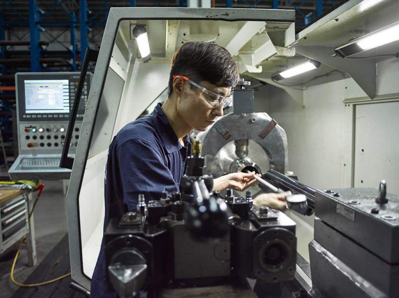 industrial portrait photography of man at work at Bohler Pacific Singapore. Environmental portrait photography of men at work by professional corporate photographer.