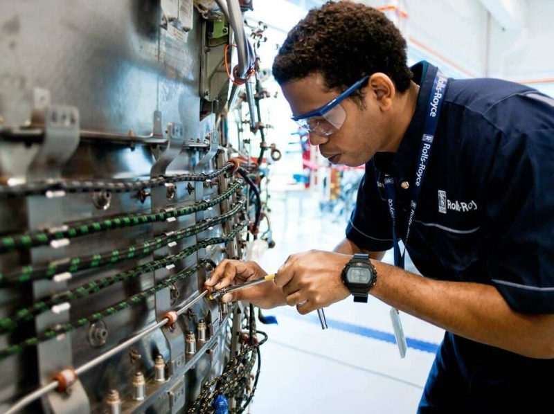 corporate industrial portrait of man at work at Rolls Royce aerospace Singapore. Environmental portrait photography of men at work by professional corporate photographer.. Commercial photography Singapore by professional portrait photographer, industrial portrait photography and group portraits photography services